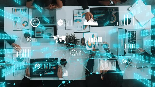 Top view of diverse business people discuss at meeting table with financial statistic holographic. Group of startup team brainstorm idea about stock investment or digital data analysis. Directorate.