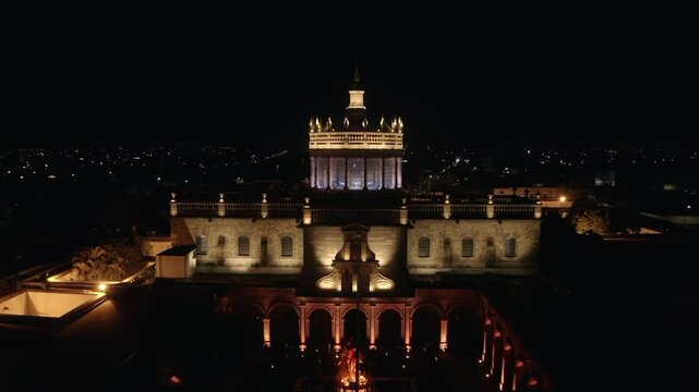 This is the Hospicio Caba&ntilde;as, a historic building in Guadalajara Mexico. The drone flies over the building showing us the magnificent building illuminated by the lights of an event at night