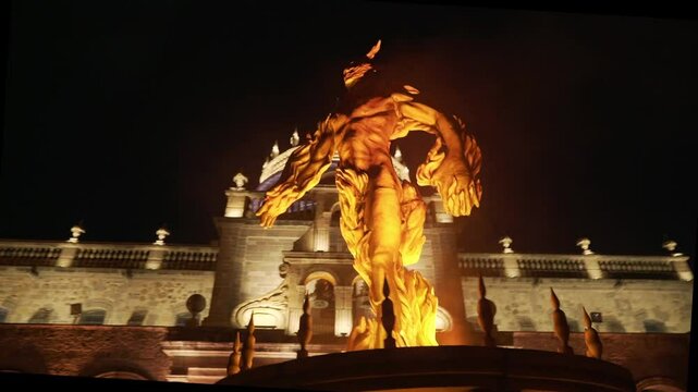 This is the Hospicio Caba&ntilde;as in Guadalajara Mexico at night. It is a historic building that constantly hosts large social events. This sculpture is a representation of the Hombre en llamas mural.