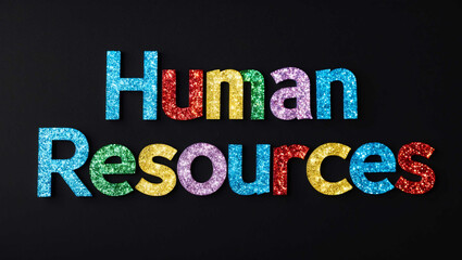 Fototapeta premium human resources word lettering made of colorful glitter shining effect on plain black background