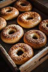 Close-up of Sesame Seed Bagels in a Wooden Crate.