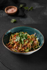 Vibrant Georgian Salad with Vegetables and Nuts in Rustic Natural Light on Dark Background