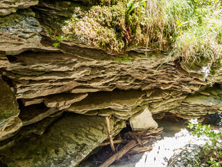 Sheer cliffs frame ancient ruins, reminiscent of past greatness, creating a mystical atmosphere and sense of time