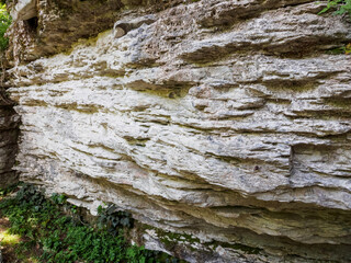 Sheer cliffs frame ancient ruins, reminiscent of past greatness, creating a mystical atmosphere and sense of time