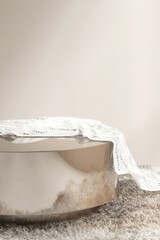 Round gold chrome podium table on shag rug with white lace throw blanket in sunlight on beige wall for luxury, elegant cosmetic, skincare, body care, beauty product display background 3D