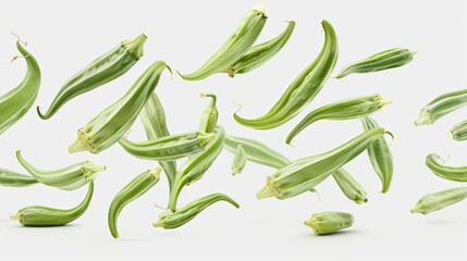 Scattered okra pods floating in mid-air against a pristine white background, showcasing vibrant green colors and intricate details