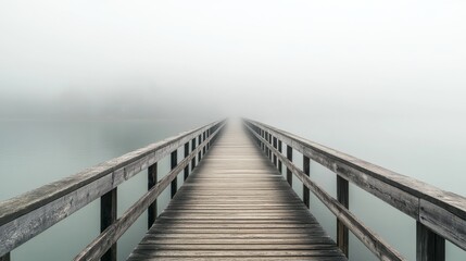 Fototapeta premium Wooden Bridge Leading into Foggy Lake