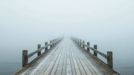 Obraz premium Misty Wooden Dock Leading to the Horizon