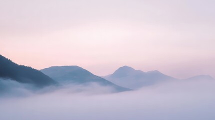 Fototapeta premium Misty Mountain Range at Sunrise - Serene Landscape Photography
