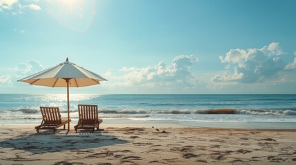 Obraz premium A beach scene with two beach chairs under a white umbrella