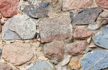 A wall made of rocks with a variety of colors