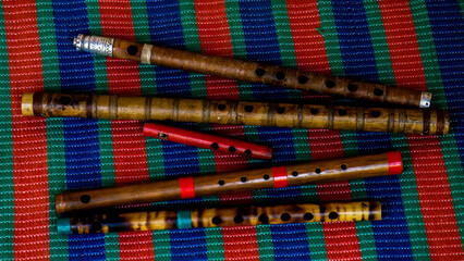 Flute of Bangladesh. Handmade bamboo flute. The flutes are arranged in rows. Close-up image of the flute. © Masud