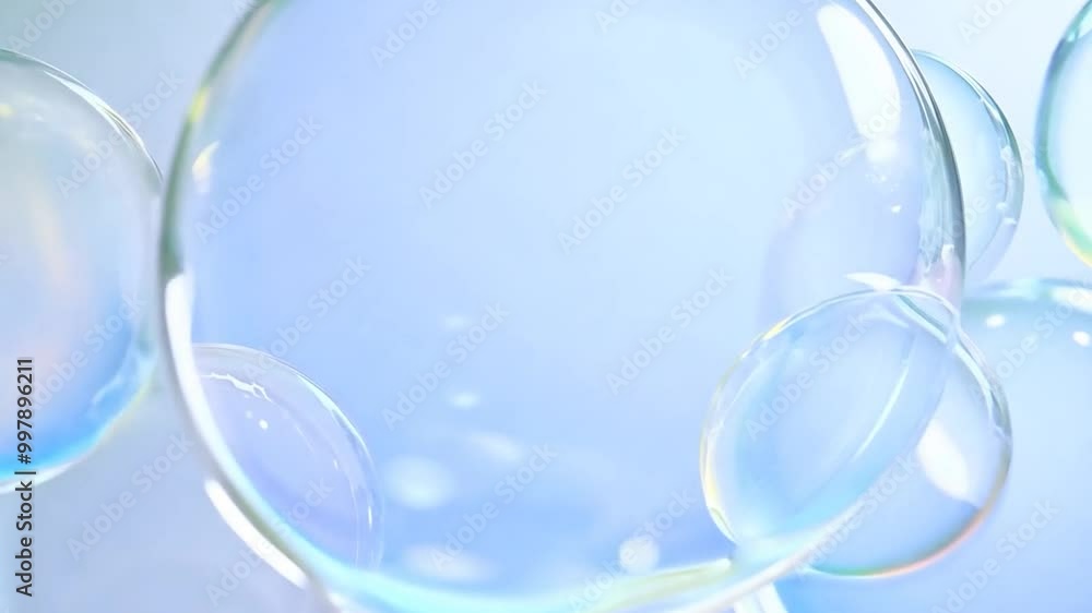Poster soap bubbles float gently upward against a blue background. their transparent surfaces create a mesm