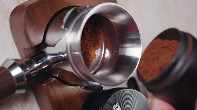 Barista making coffee with Espresso machine from the bottom