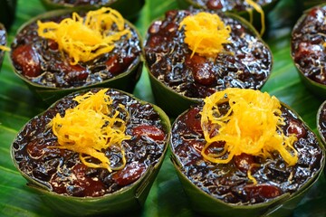Thai dessert, coconut milk top, butterfly pea flower color, sprinkled with golden floss.