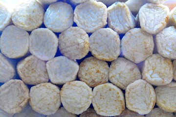 Fish balls in the form of round sticks, stacked on top of each other.