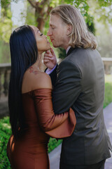 Fototapeta premium This romantic engagement photoshoot captures the unique love story of a diverse couple, celebrating their heartfelt proposal and creating unforgettable memories they will cherish for years