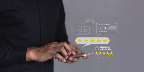 Consumer Satisfaction, Young Man hand using smartphone mobile with five star to review and give 5 stars with very good results in service, Good review 5 star rating choice feedback
