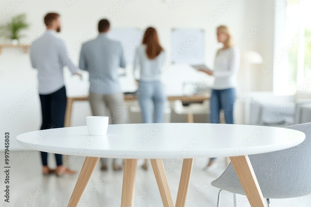 Poster business team collaborating in a modern office setting with a focus on a coffee cup on a table durin