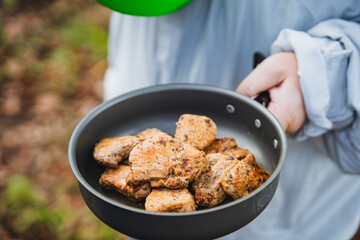 Enjoy an unforgettable outdoor cooking adventure with delicious grilled chicken bites in the captivating beauty of nature with loved ones