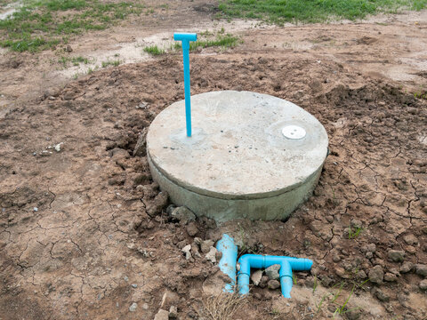 The concrete septic tank.