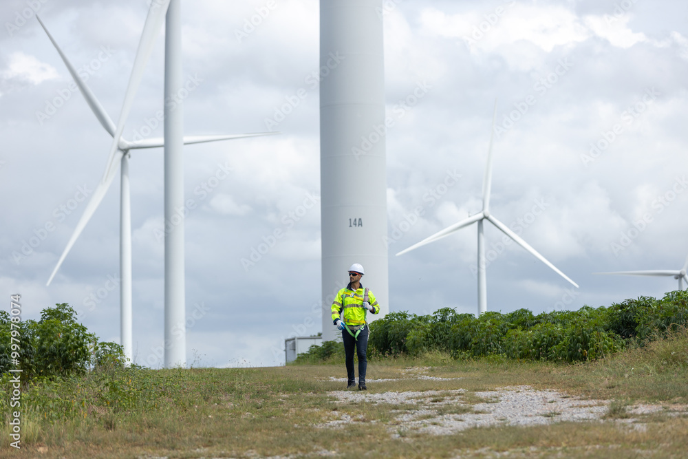 Poster Man engineers holding tools box and rope to maintenance working in wind turbine. Renewable energy power wind turbine. Technology protect environment reduce global warming problems
