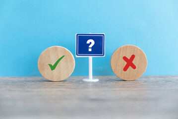 Concept of evaluation. True or false symbol. Accepted or rejected. Yes or no icon over a wooden...