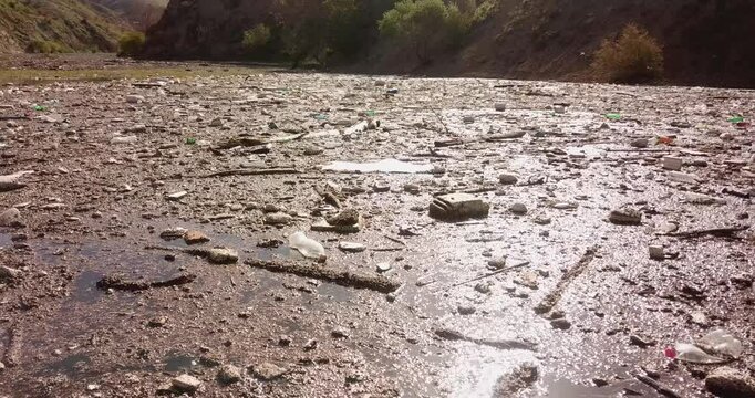Aerial views of Tehran iran today water source lakes reveal alarming pollution as garbage and plastic accumulate in the water endangering the lush Hyrcanian forest and damaging the natural landscape