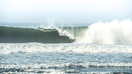 Dangerous high tide wave on the beach. Congot beach Kulon Progo, Yogyakarta, Indonesia.