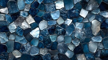 A luxurious mosaic wall made from a mix of smooth and rough sea glass tiles, with hues of sapphire, deep teal, and silvery white creating a cool, sophisticated oceanic design