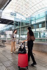 Businesswomen arriving at the airport. Commercial corporate flights.