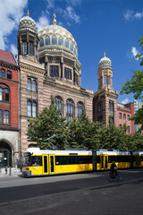 Obraz premium New Synagogue in Berlin Showcasing Moorish Architecture and Tramline