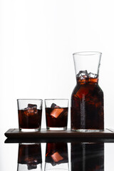 vertical view cold brew coffee with striking contrast enhances the color of the coffee looking fresh isolated on a white background. Space for text