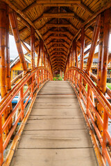 Fototapeta premium Traditional bamboo bridge in La Cocha, Nariño, Colombia