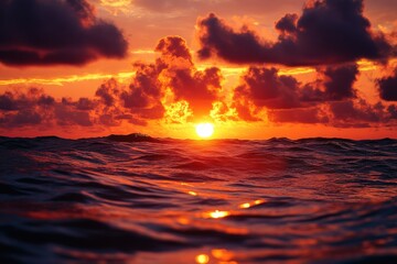 Stunning sunset over the ocean, vibrant colors reflected in the waves.