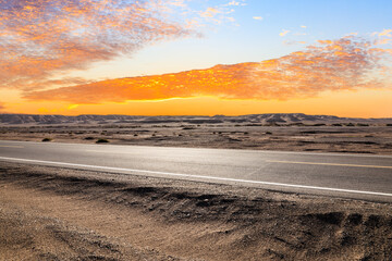 Asphalt highway road and desert natural landscape at sunset. Car background.