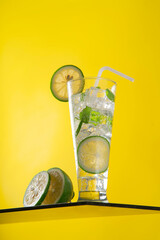 Mojito cocktails with mint leaves and lime slices with warm background