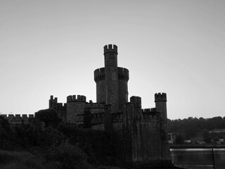Blackrock castle observatory silhouette in the rays of sunset sun black and white monochrome...