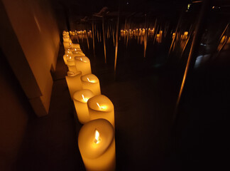 Artificial electric candles close view background, romantic atmosphere