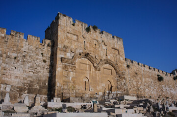 The stone walls of the Old City of Jerusalem and the sealed Mercy Gate and twin arches. © Yehoshua Halevi