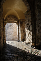 Cobblestone road leading through the Zion Gate entrance to the Old City of Jerusalem.