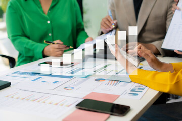 financial asian advisor showing plan of investment to clients in the consultancy office.