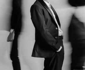 person in black suit, motion blur