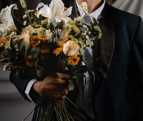 person in a suit with flower valentine romance
