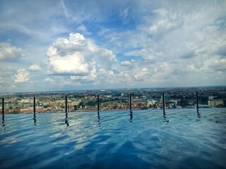 rooftop swimming pool at the zuri hotel. cloudy blue sky