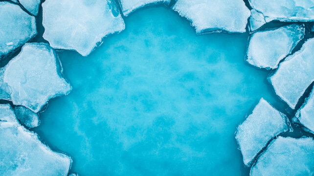 Frozen river slowly thawing from space large chunks of ice breaking apart on a glacial blue background 