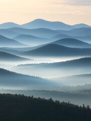 Fototapeta premium A misty morning over rolling hills creates a layered, abstract landscape with subtle color variations.