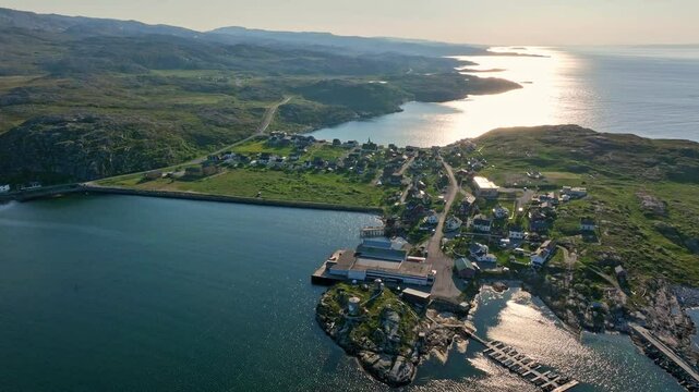 Aerial view circling the Bug&oslash;ynes village, sunny, summer day in north Norway