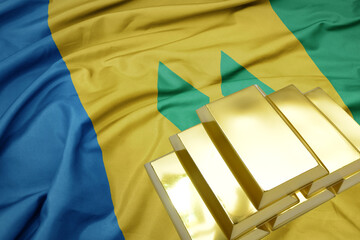 shining golden bullions on the saint vincent and the grenadines flag background.
