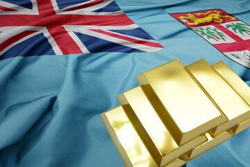 shining golden bullions on the Fiji flag background.